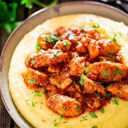 Saucy Chicken And Sausage Over Creamy Parmesan Polenta