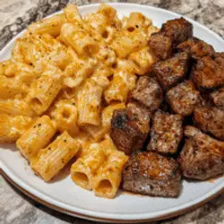 Cajun Steak Tips In Cheesy Rigatoni Parmesan Sauce